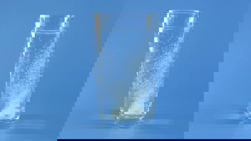 Glass Of Water With Effervescent Tablet Dissolving