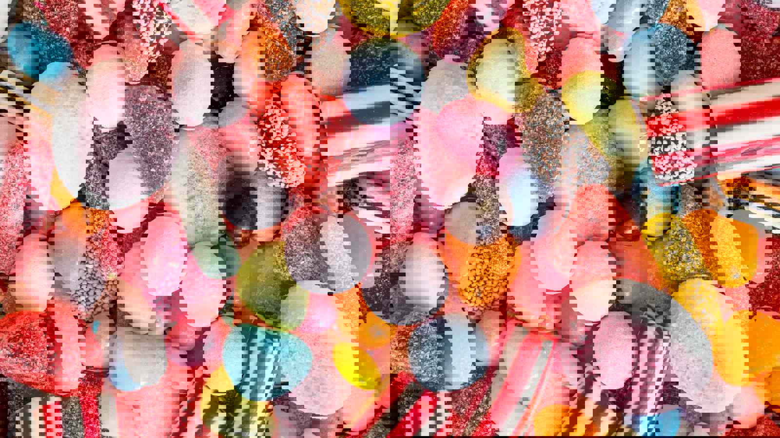 Jars containing brightly coloured confectionery