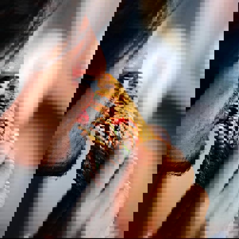 Man taking a big bite