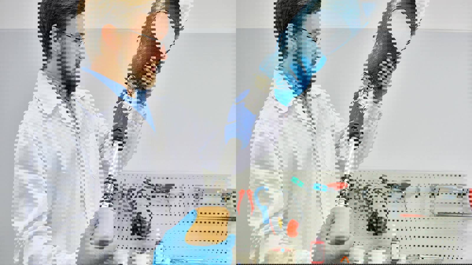 Lab technician holding prosthetic leg