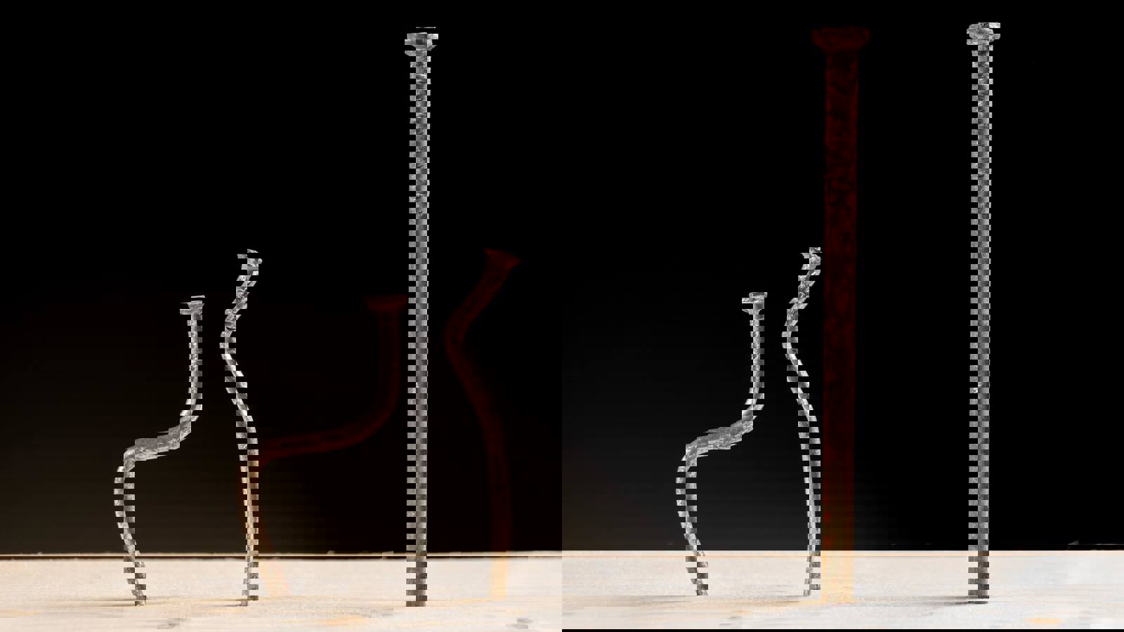 3 nails sticking out of wood demonstrating hardness