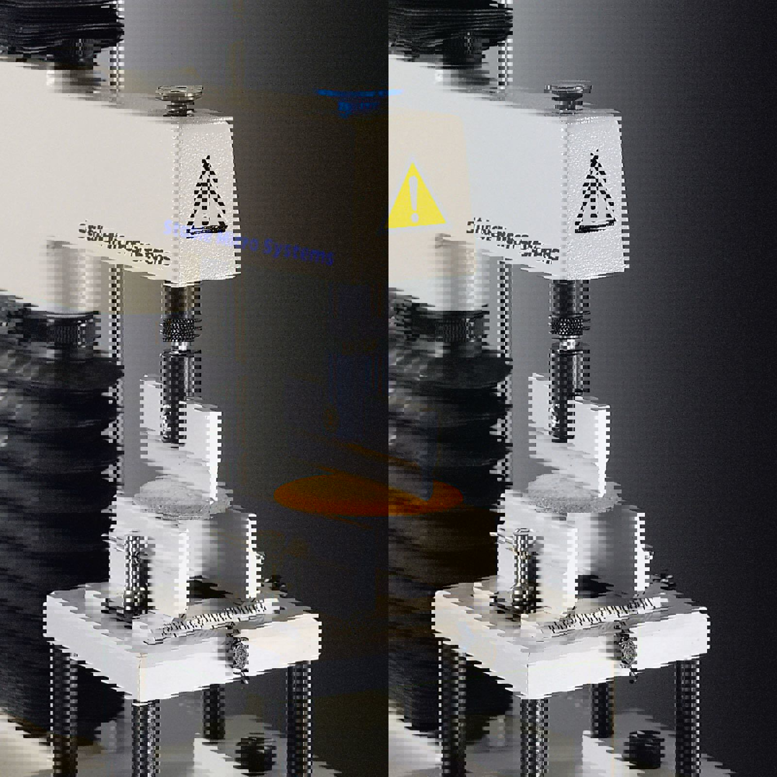 Three Point Bend rig attached to a Texture Analyser performing a test on a biscuit